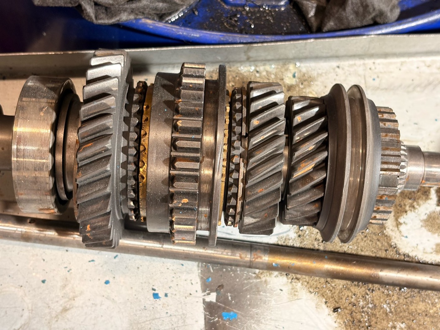 A Ford Type E gear cluster laid out on its mainshaft