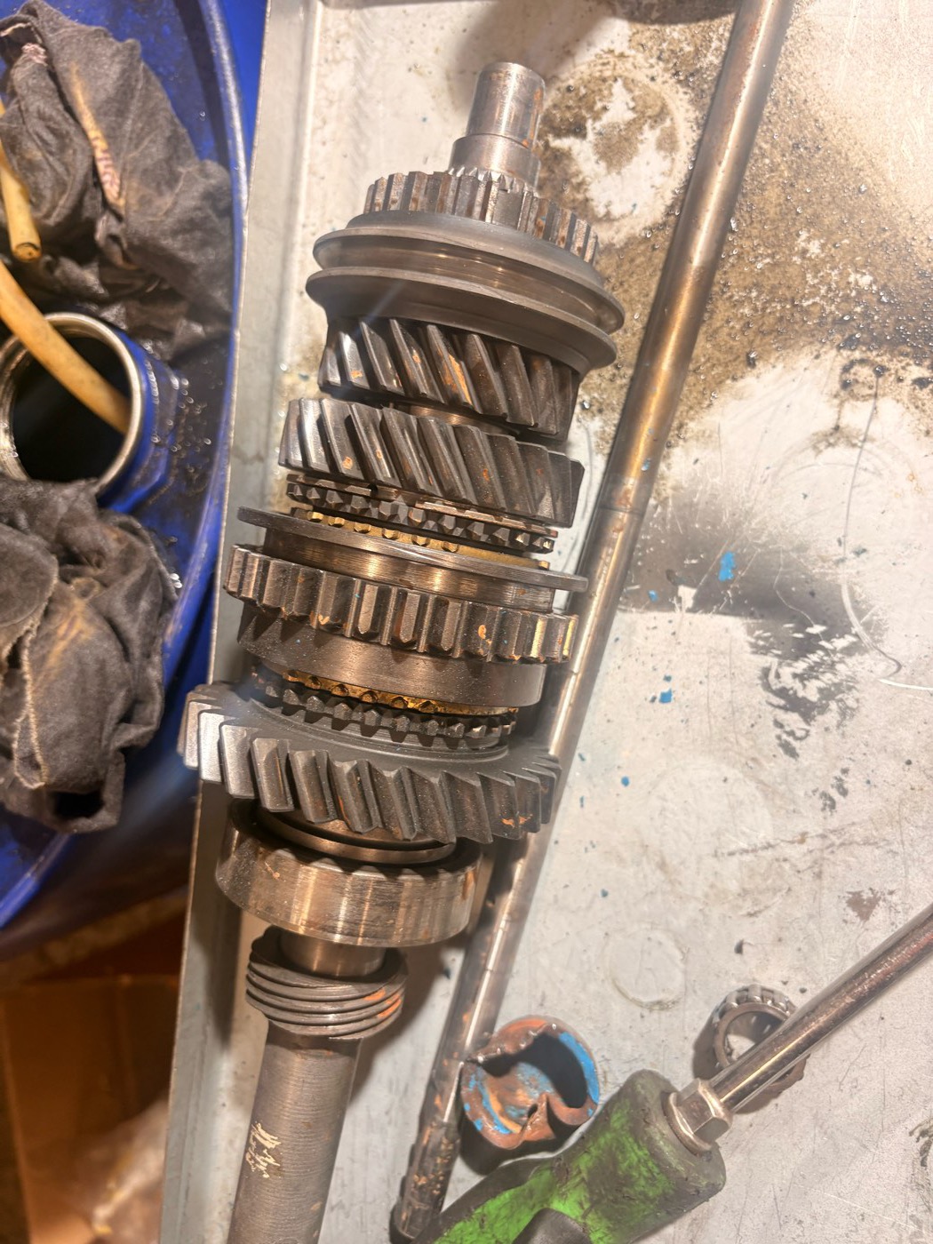 A Ford Type E stripped down on the bench, its gears, shafts and selector components laid out