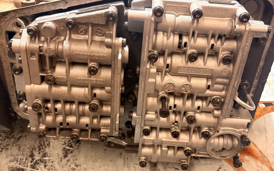 A ZF valve body on the bench with its solenoid pack still attached